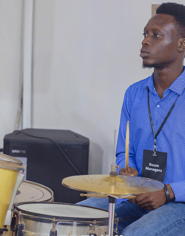 Volunteer with drums